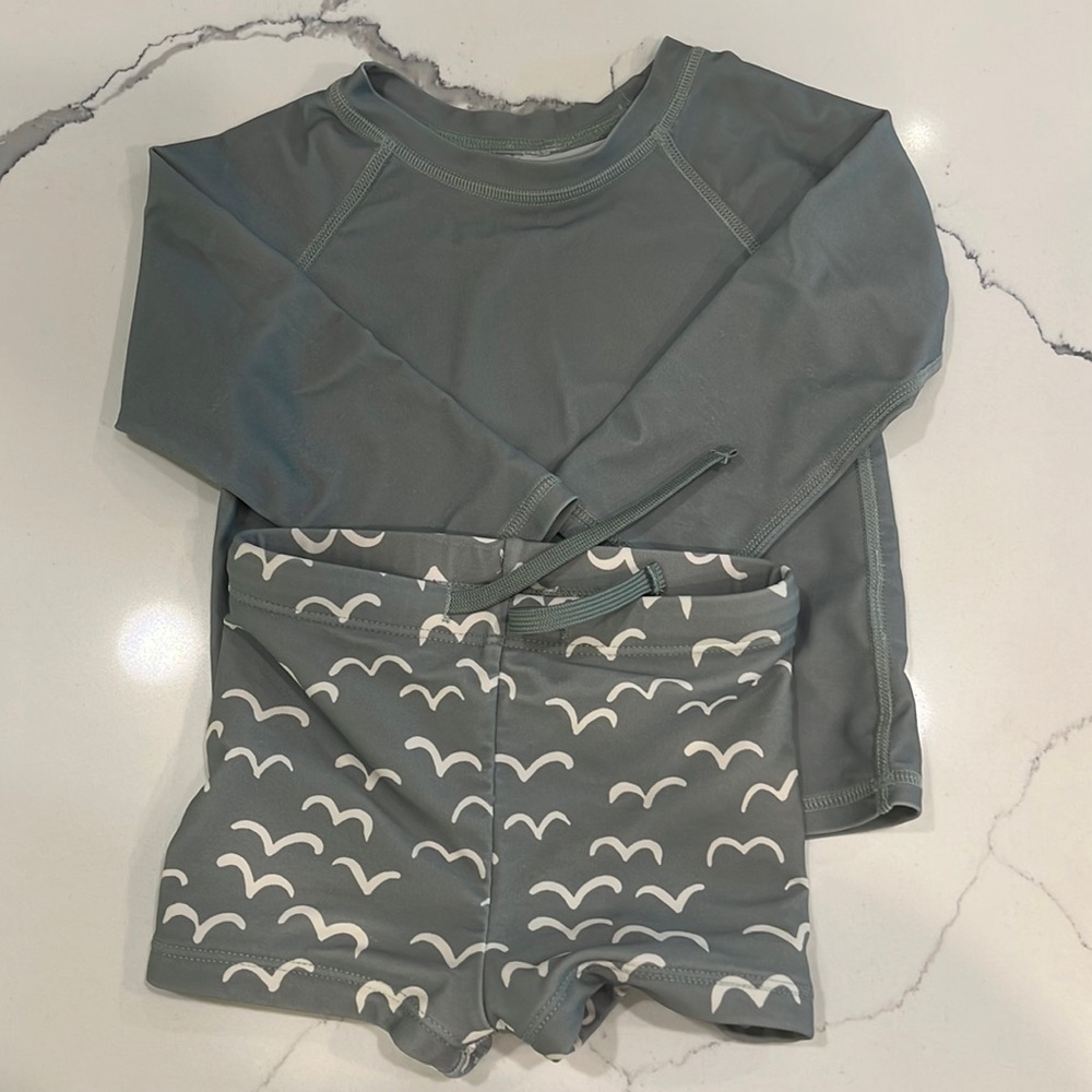 Rylee + cru Rash guard and swim trunk set.